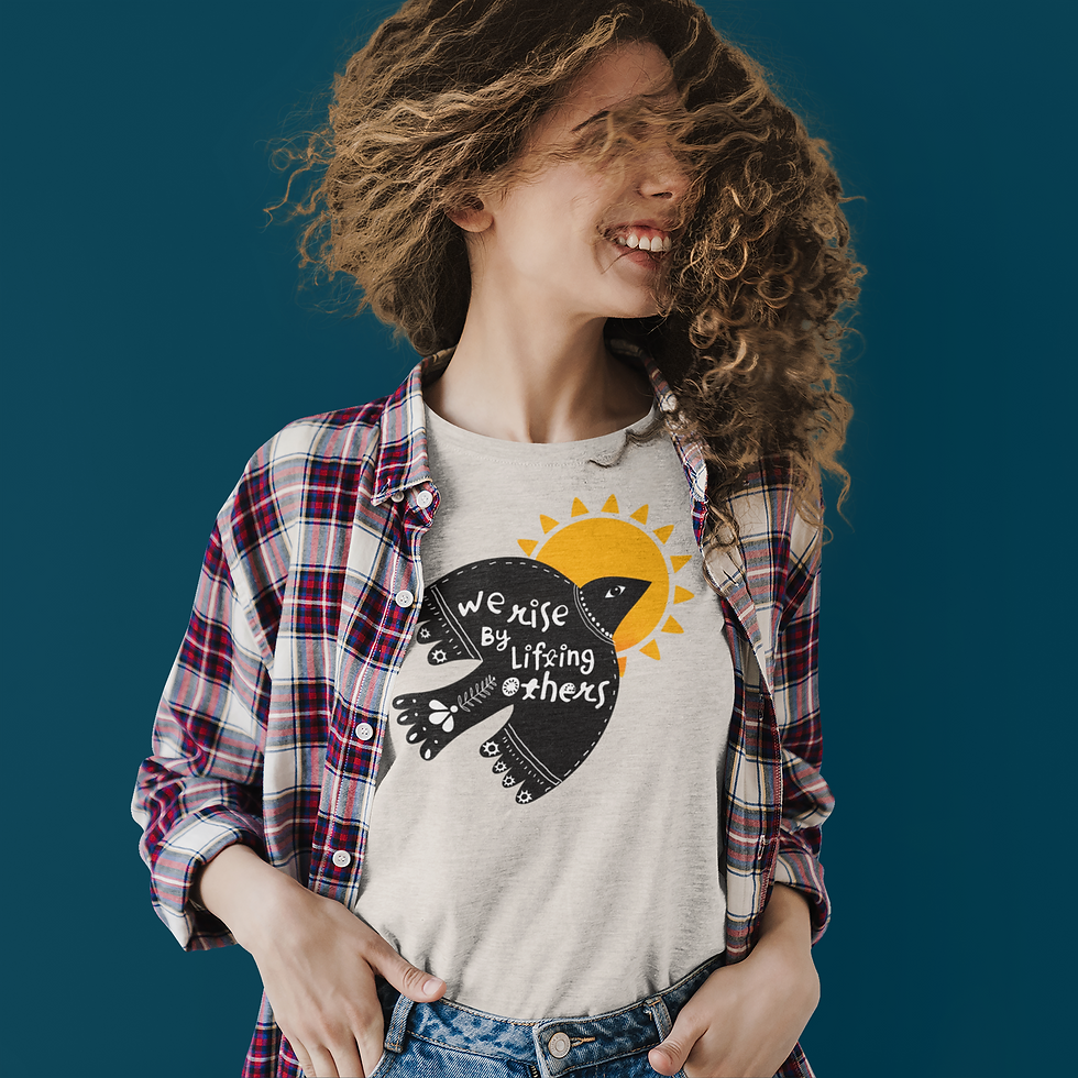 Thumbnail: person wearing We Rise by Lifting Others t-shirt with black dove and yellow sun graphic on front