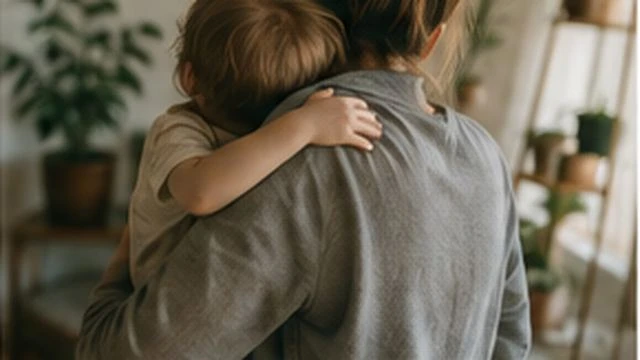 Caregiver holding a child in a warm home