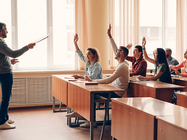 Friendly teacher is talking to cheerful