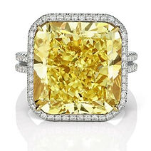 SD_18+ carat Fancy Intense Yellow cushion shaped diamond halo double band ring.jpeg