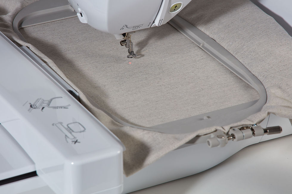 Thumbnail: Hoop with fabric attached to the embroidery unit on Innovis NV880E Brother