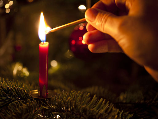 advent candle being lit