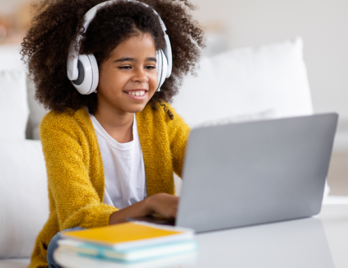 A happy little girl on her online class | Best online tutoring service