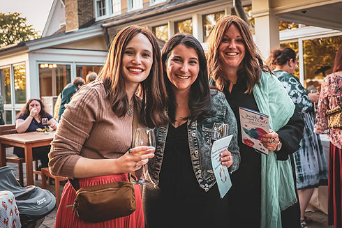 Women holding drinks at Jewish Women's Circle event in Milwaukee