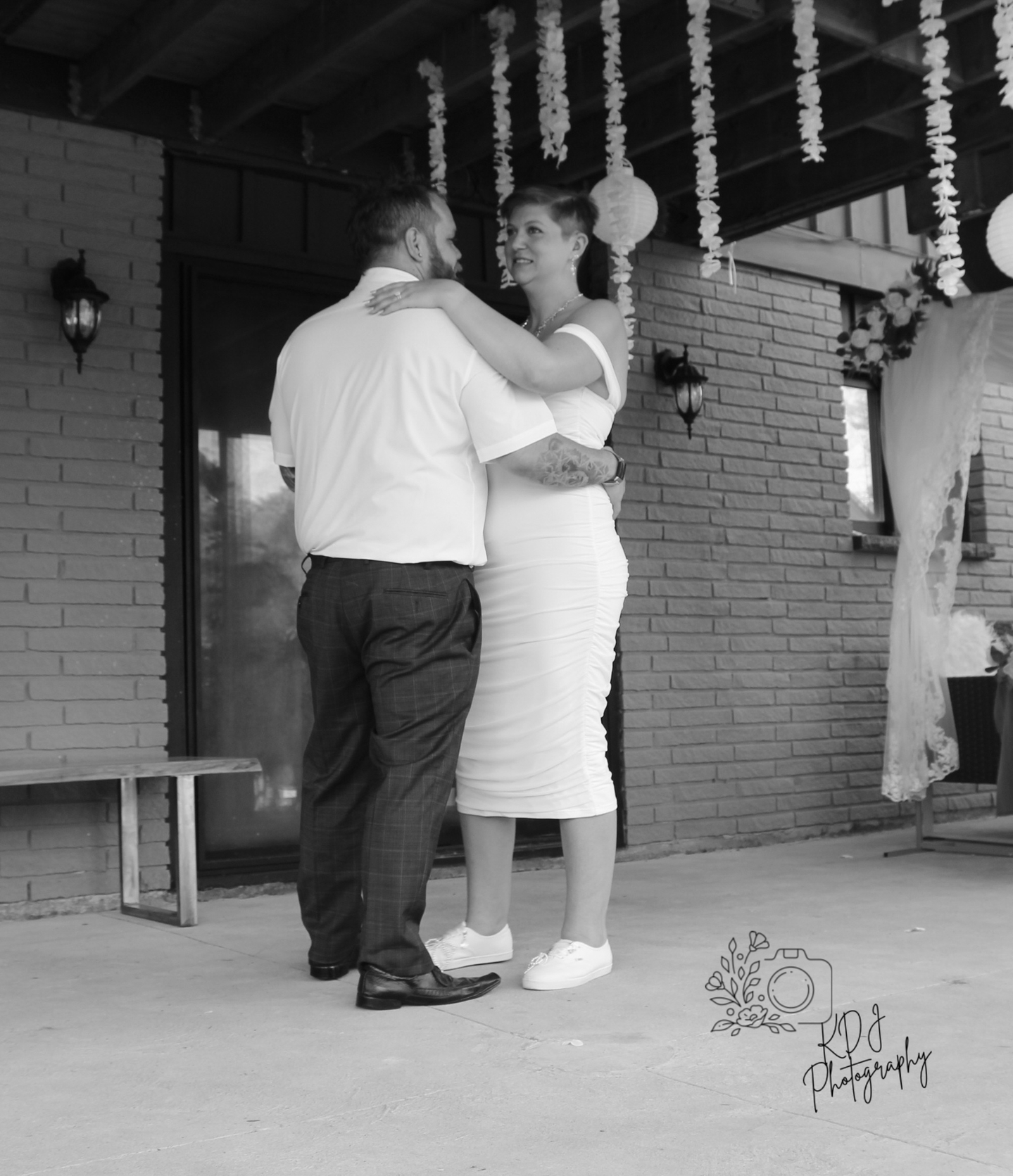 Bride and groom dance black and white