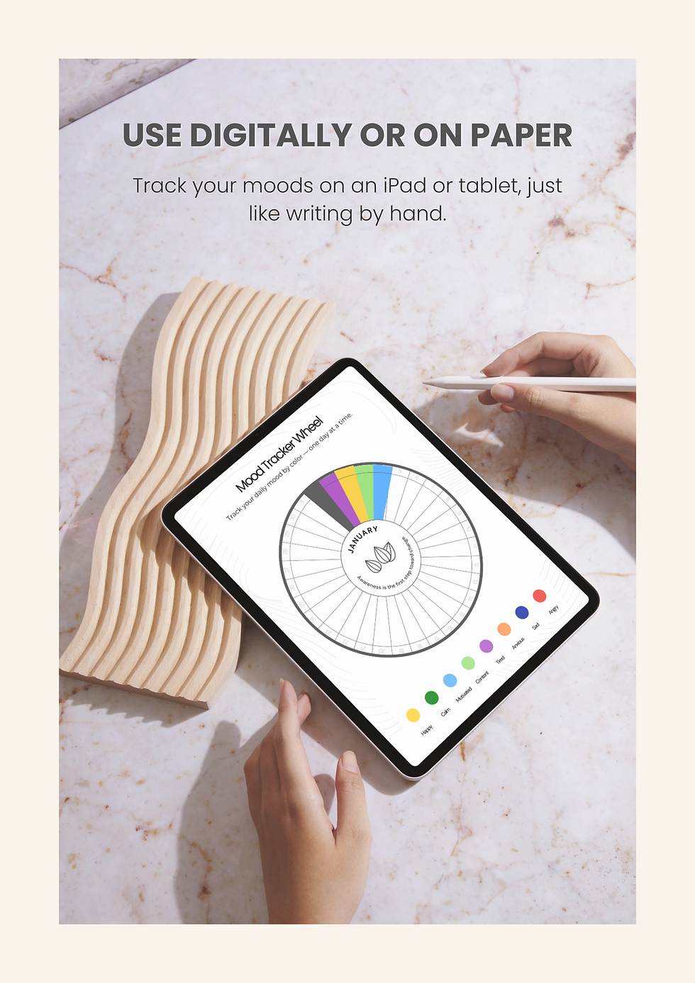 Digital monthly mood wheel tracker on a tablet with stylus.