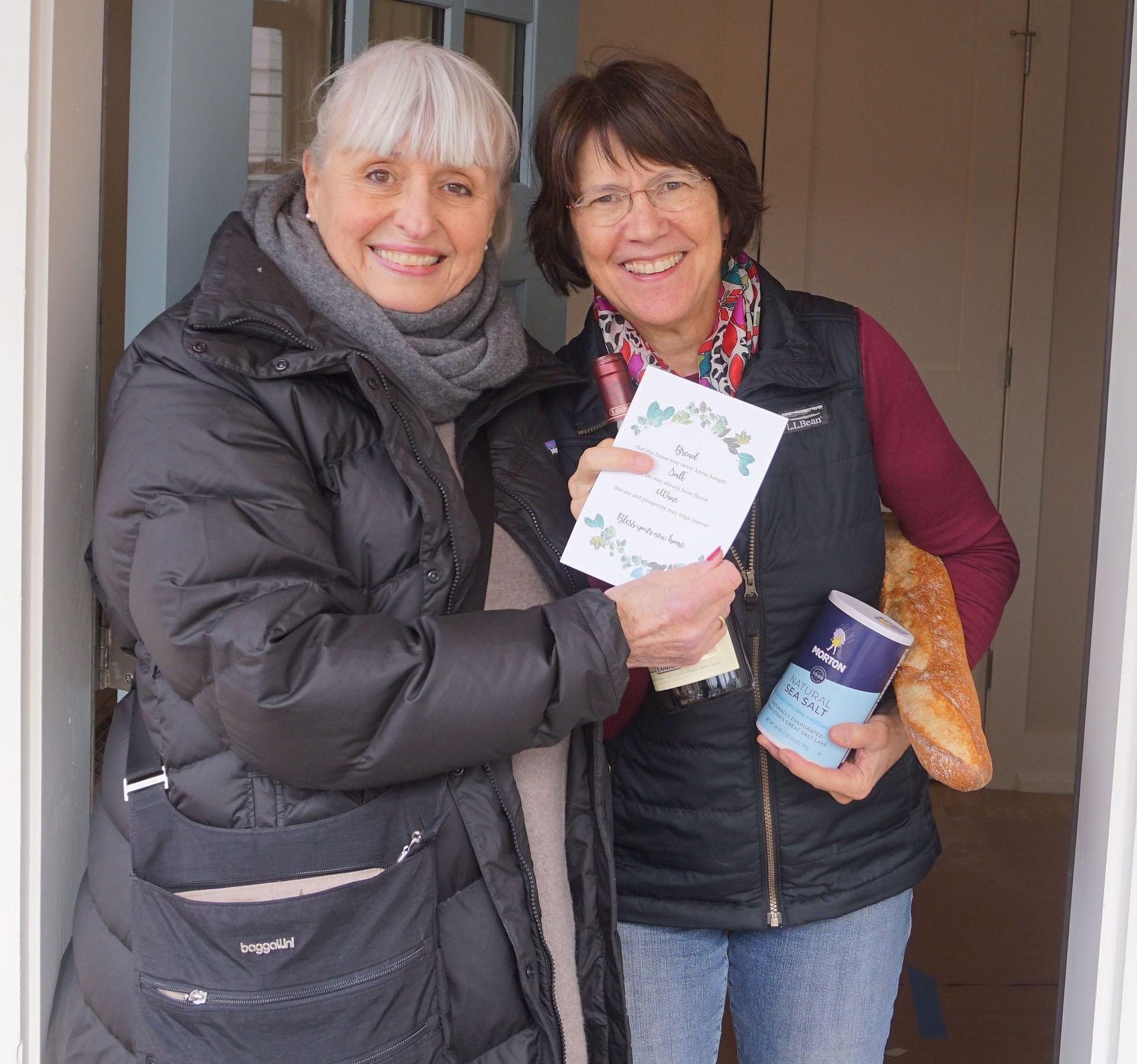 Founder Victoria presents Diane with a housewarming gift