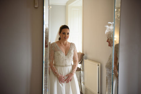 The bride standing in the doorway — JAMES and KIRSTEN wedding