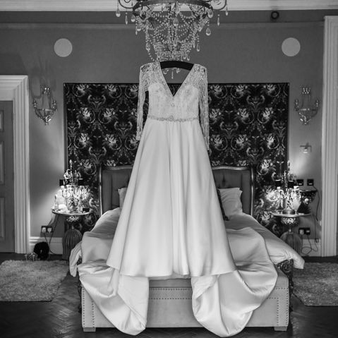 The wedding dress hanging in the bridal room — JAMES and KIRSTEN wedding
