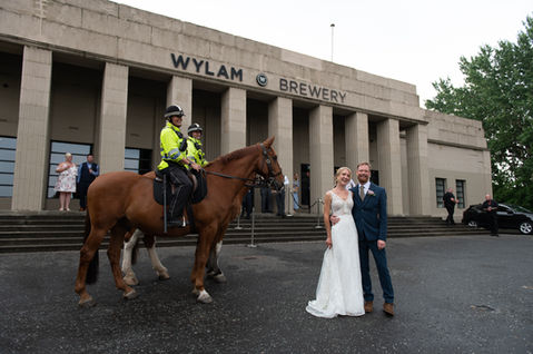 A lighthearted moment outside the brewery — OL and JULIE wedding