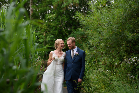 Smiling together among the greenery — OL and JULIE wedding