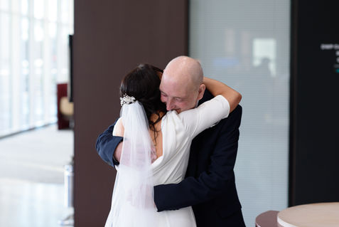 Lesley Ann embracing a loved one before the wedding