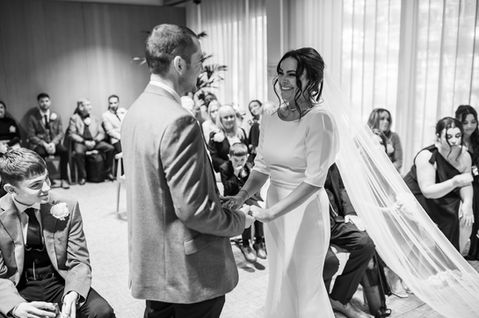 Black and white view of the couple exchanging vows