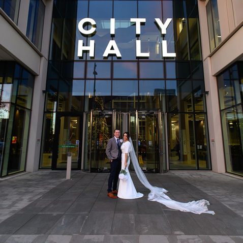 Wedding portrait beneath the City Hall sign in Sunderland