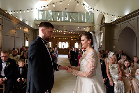 Holding hands during the ceremony — JAMES and KIRSTEN wedding