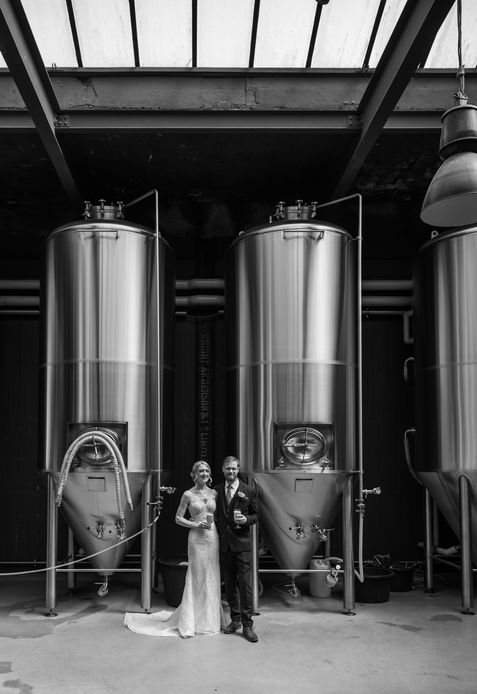 A portrait beside the brewery vessels — OL and JULIE wedding