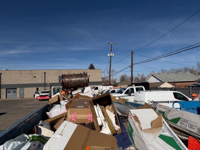 Dumpster Crunchers truck and compactor in action on a job site