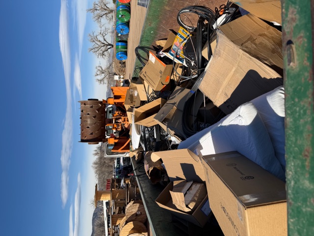 Before — overflowing dumpster