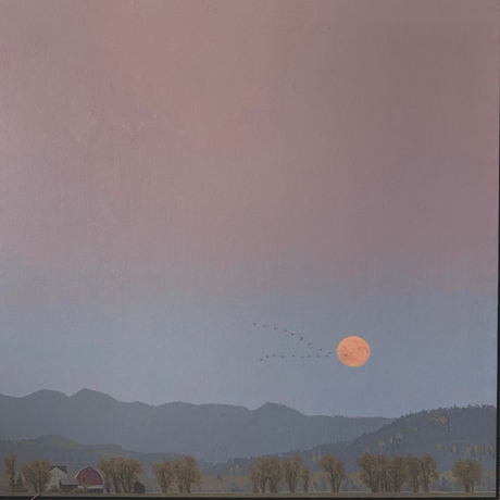 Full orange moon above mountain range by andrew bolam