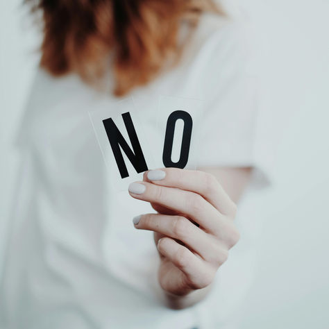A women holding the word No