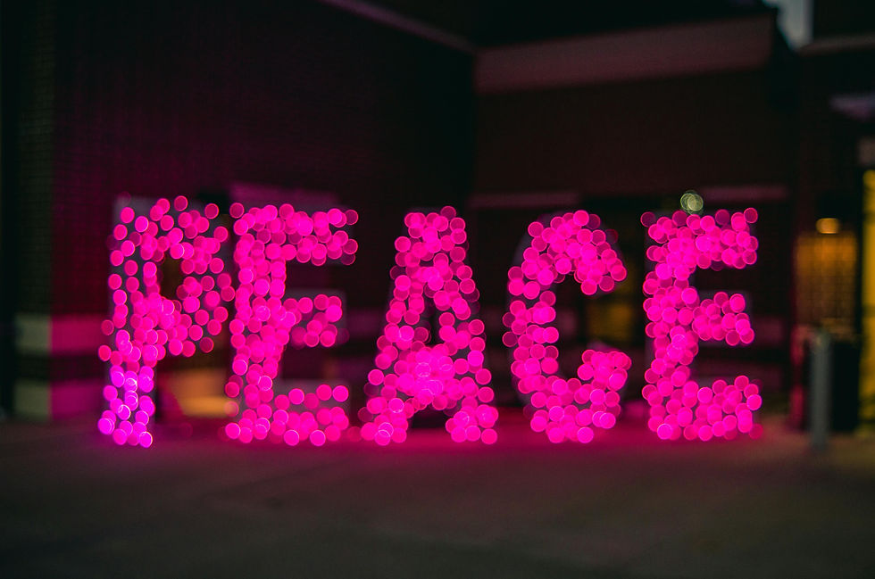 Pink Lighted Sign saying Peace