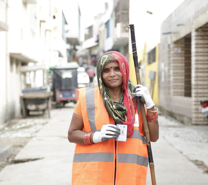 Sanitation_Worker_Showing_ID.JPG