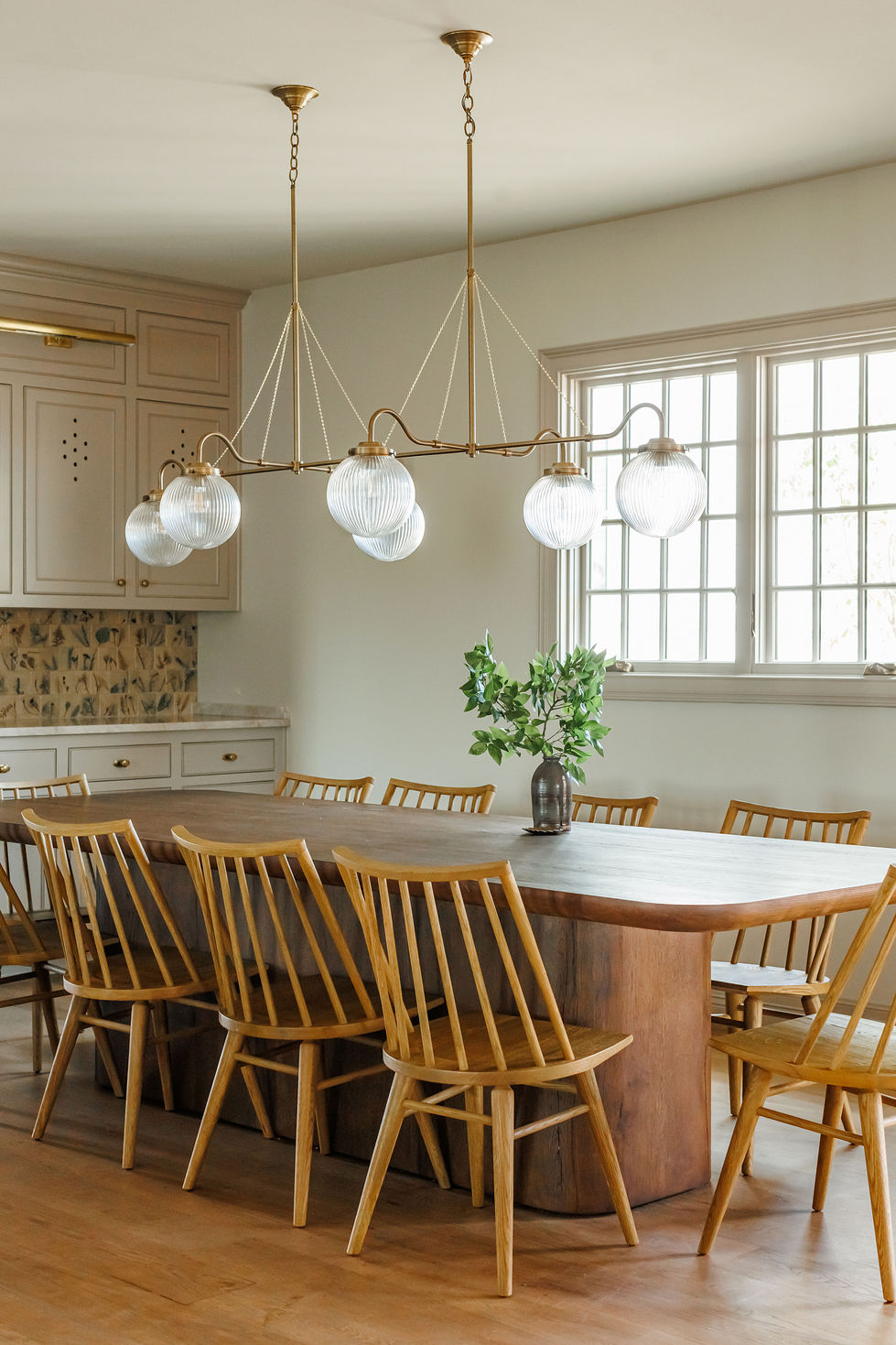 Elegant dining room with wooden table and chairs.