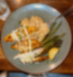 fish over risotto and asparagus on the side