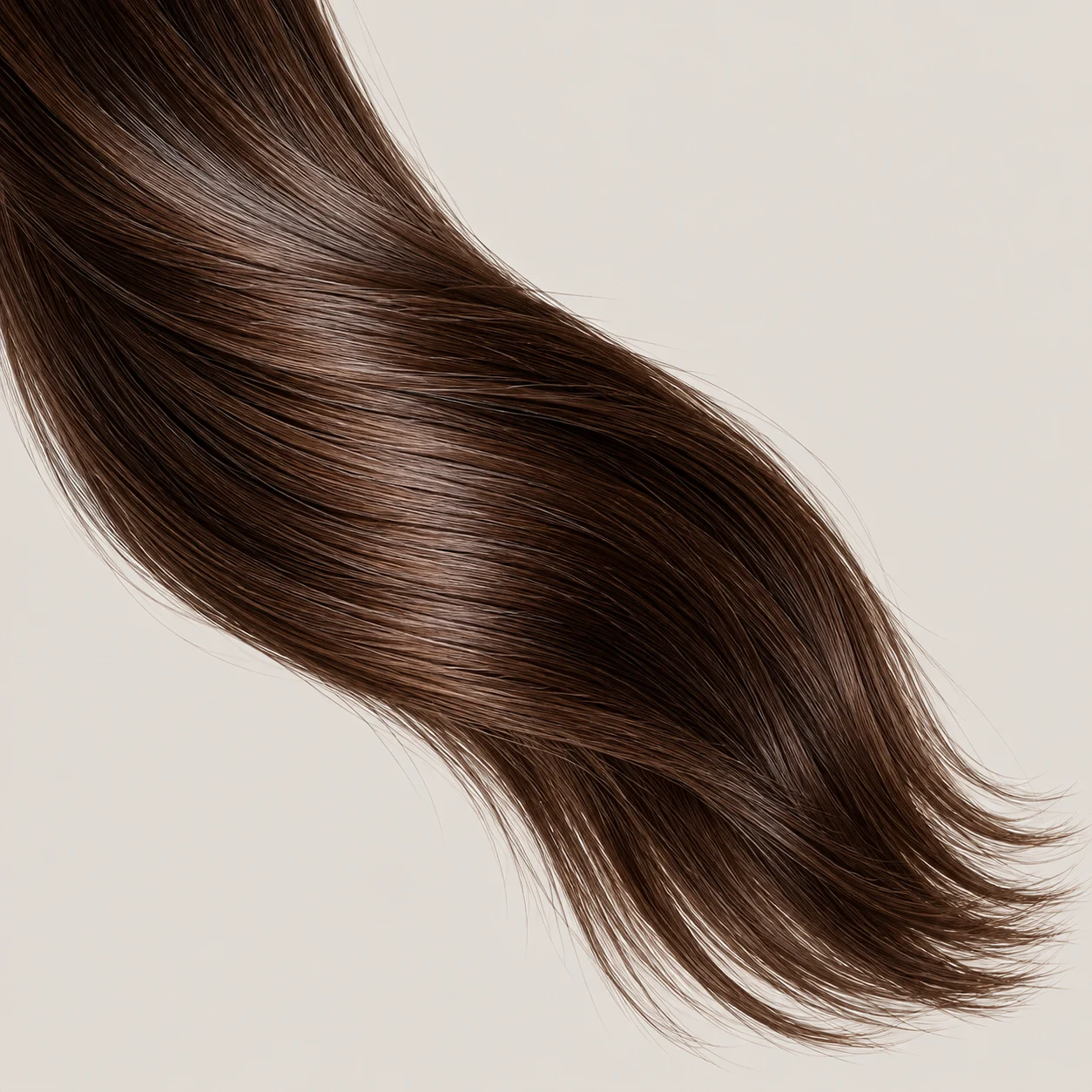 A smooth curve of espresso-brown hair with natural shine after glossing.