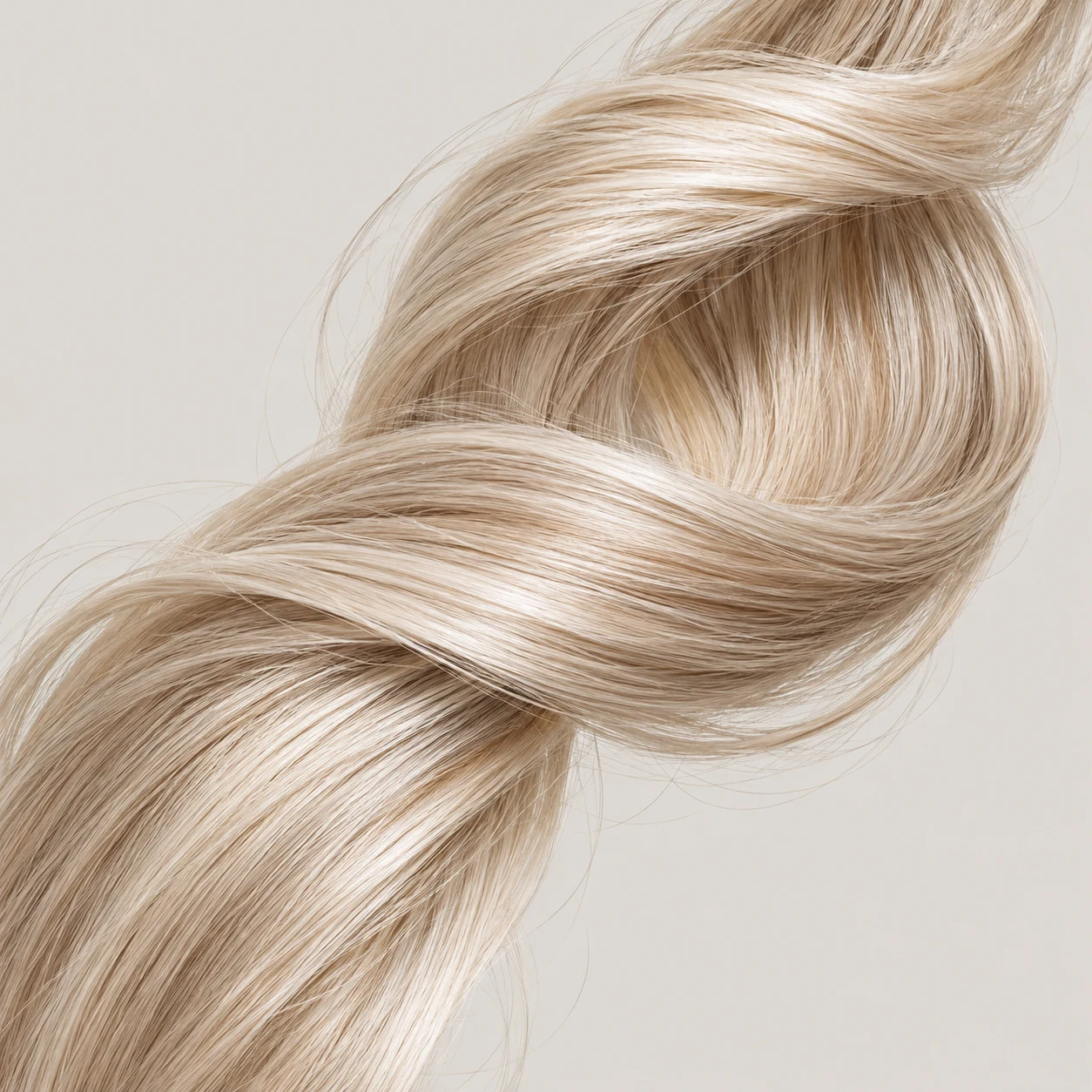 A pale blonde hair ribbon with refined pearl-beige tone.