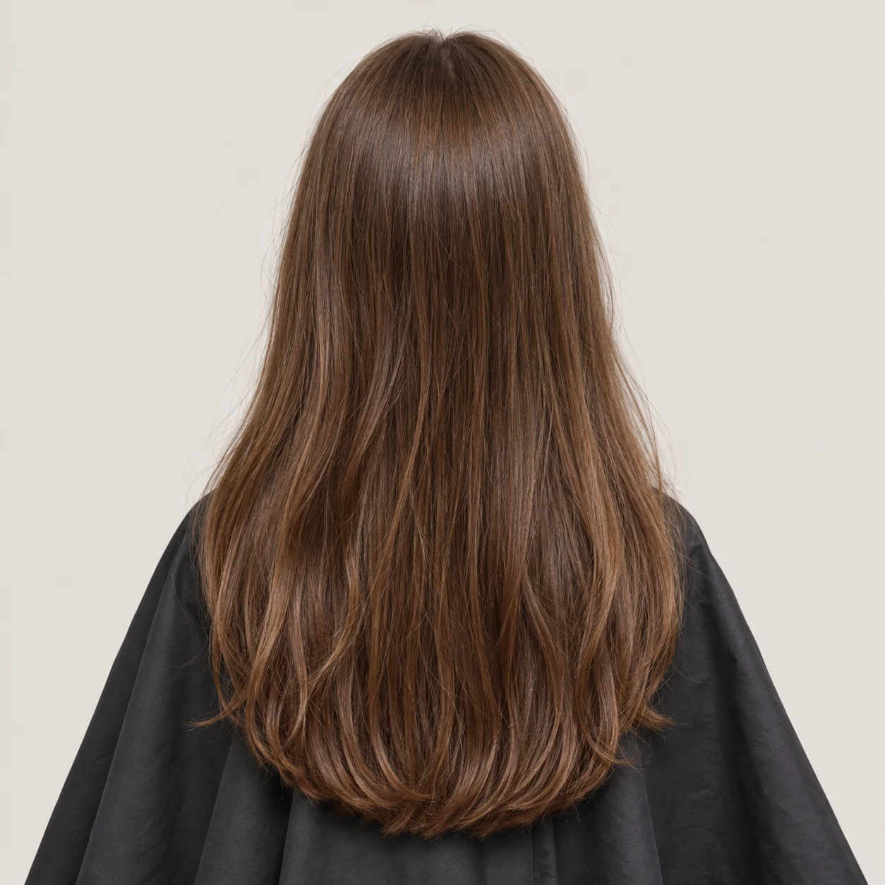 Long natural chestnut hair with neatly trimmed U-shaped ends.