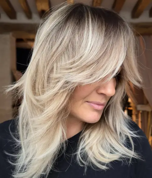girl with mid length haircut with face framing layers 