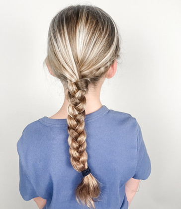 Girl with a tight braid after lice treatment is complete