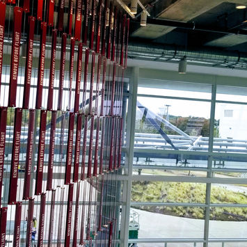 Modern corporate interior of the American Airlines HR building featuring custom-fabricated metal partitions and architectural ceiling elements by GST Manufacturing.