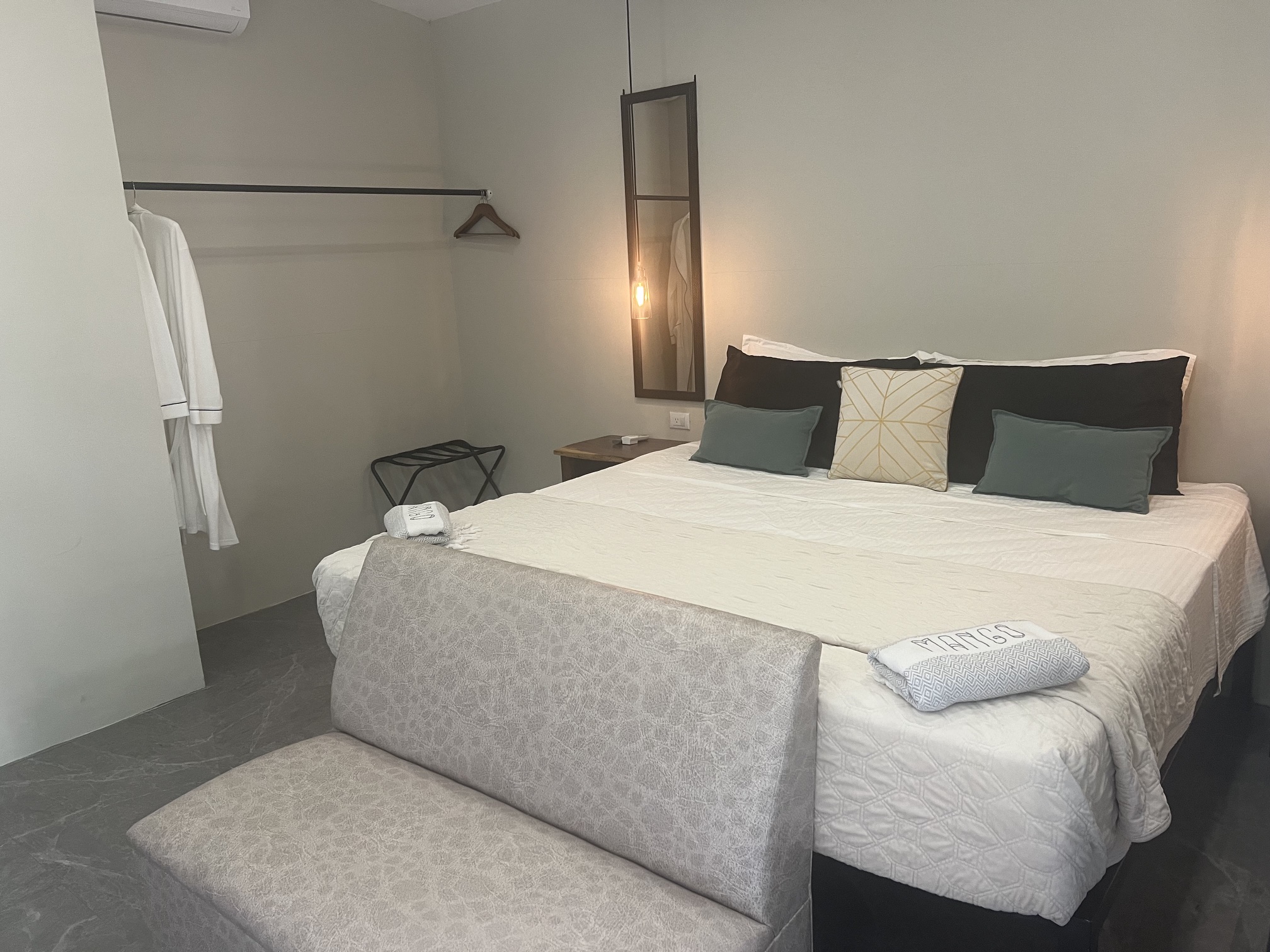 Modern tropical guest bedroom at Sueño Mono
