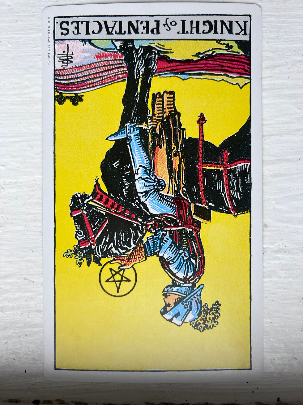 Knight of Pentacles reversed