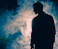 the-man-silhouette-standing-in-the-smoke-evening-2024-12-05-06-38-28-utc.jpg