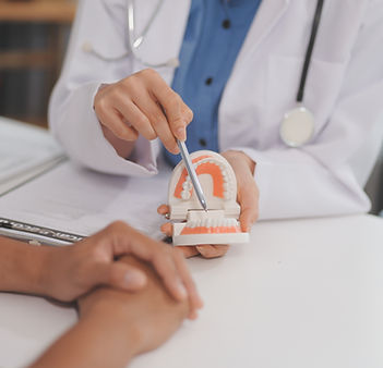 Dentist consultation - patient visit at the dental clinic office. Female dentist wearing d