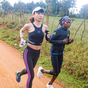 Kenya Camp guest on her morning run guided by pacers
