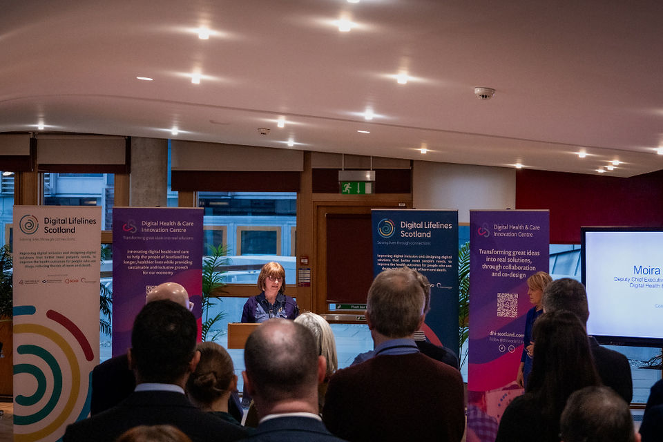 Moira Mackenzie presenting at Digital Lifelines Scotland Parliamentary Reception