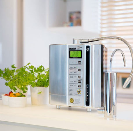 Silver LeveLuk SD501 Platinum water ionizer on a kitchen countertop with plants.