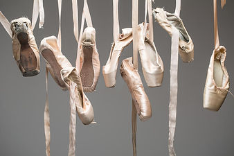 ballet-shoes-pointe-isolated-many-pairs-hang-haphazardly-hanger-different-condition-new-to