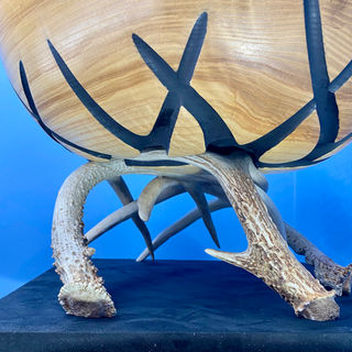 Very large ash bowl turned on the lathe and deeply carved and painted to accept the large deer antler base.