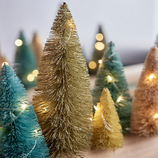 brush trees and fairy lights, holiday decorations by Hem Collective