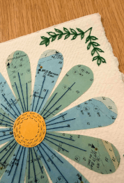 Paper embroidered flower made from a maritime chart