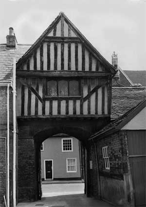 A timber framed building built over an archway