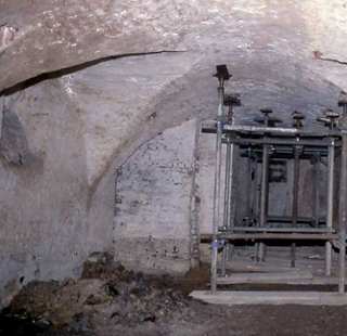 Vault of an old building with metal props