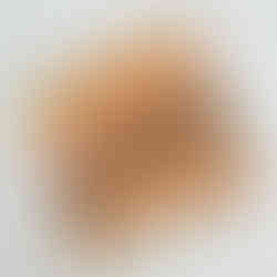 Waterco with a stitched design embroidered onto the paper.