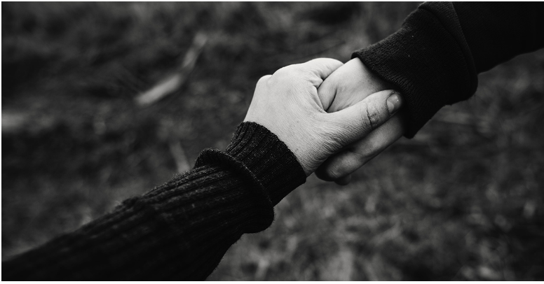 man and woman holding hands