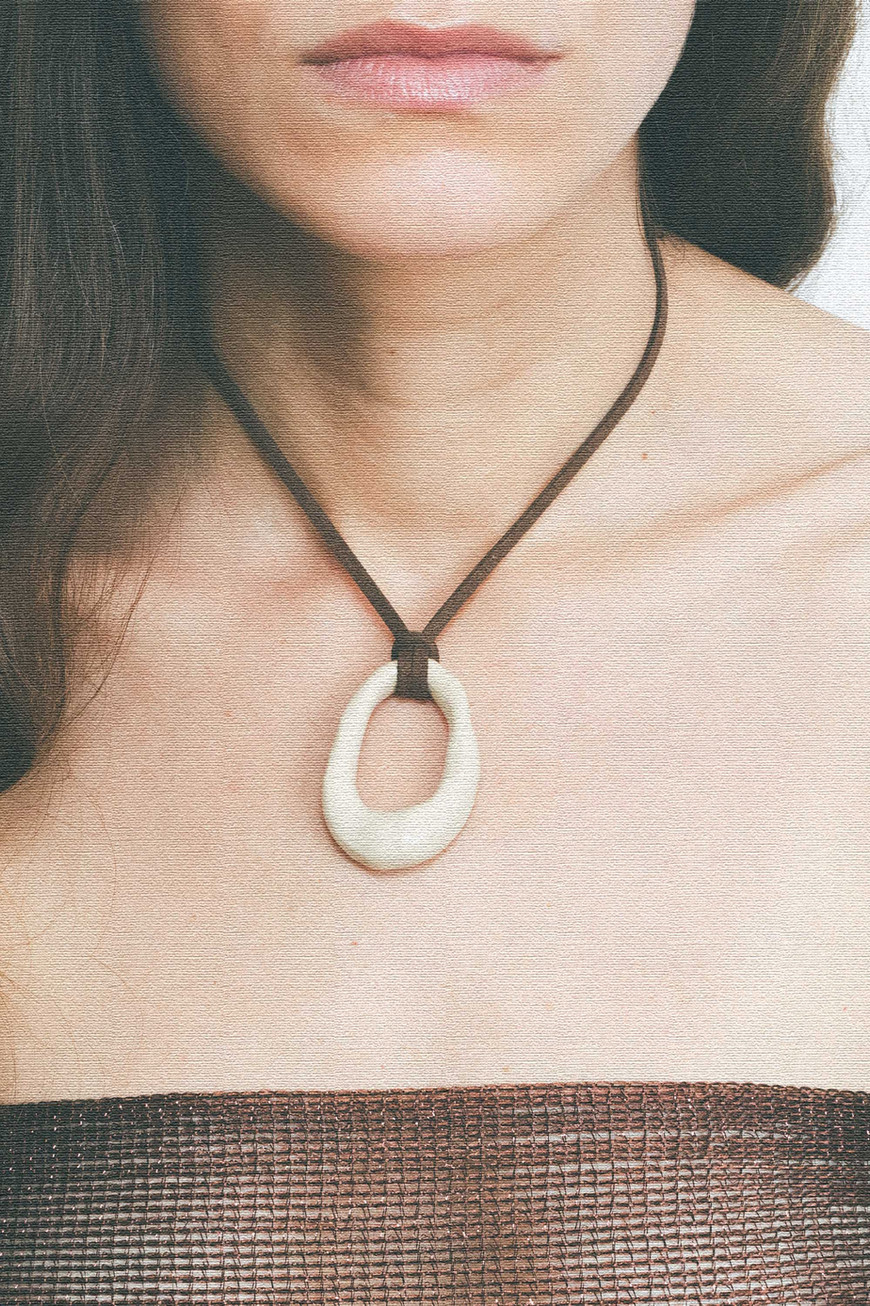 Bone Pendant In Brown